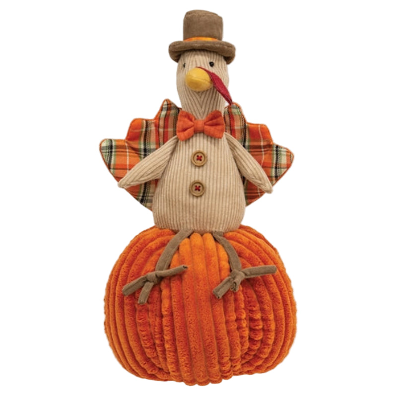 Thanksgiving turkey plush decoration seated on an orange pumpkin