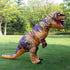 Adult wearing inflatable T-Rex dinosaur costume outdoors