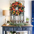 Artificial autumn wreath in a styled entryway display