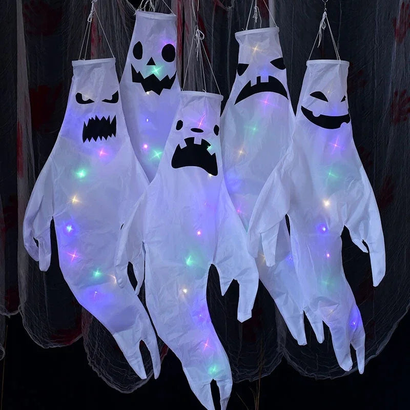 White LED hanging ghost Halloween decorations glowing at night