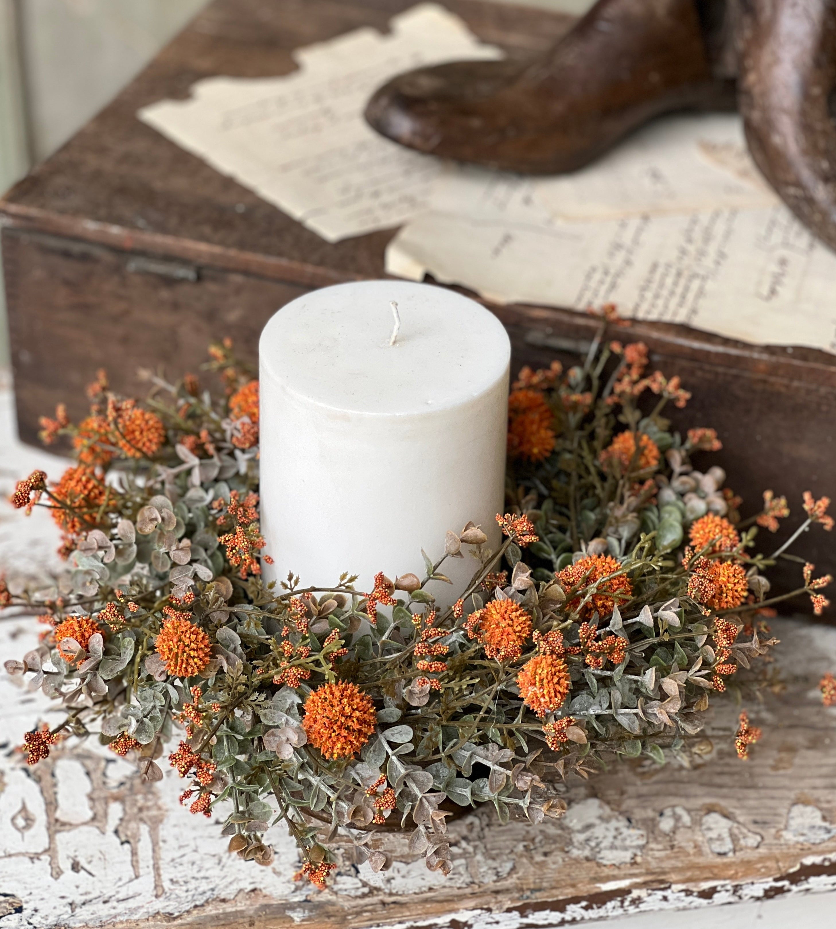 Orange fall candle ring styled around a candle; candle not included